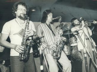 Three of nine members of the Cueball band, Don Englert, Bert Hermiston and John Verweel, are helping fill the El Mocambo bar this week at a time of th(...)
