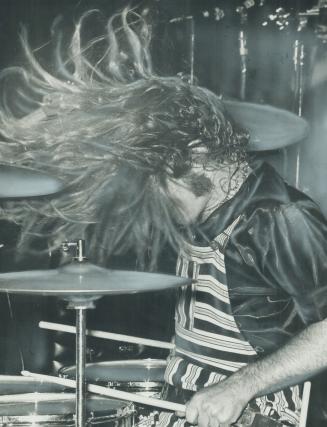 Drumming up a strom with some hair-raising stick work, Skip Prokop does his thing at Lighthouse rock band's concert in the Forum of Ontario Place last(...)