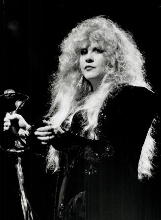 Fashion parade: Stevie Nicks changed from one black outfit to another in concert at Skybowl last night, reviewer Lenny Stoute reports