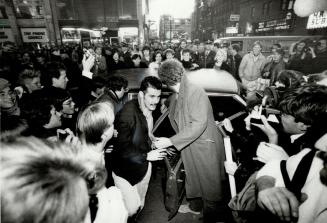 Frankie shakes up Yonge St. Paul Rutherford, of Frankie Goes to Hollywood, is greeted by ecstatic fans for an autograph session at A and A Records Fri(...)