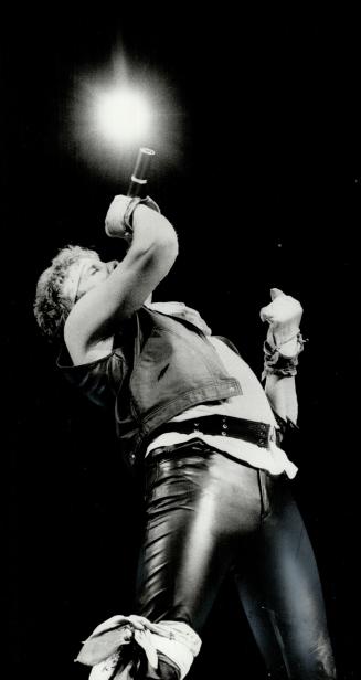 Mike Reno: Loverboy's lead singer, dressed in band's uniform of clinging black leather and bits of red and white cloth tied in various places, delivered what 18,000 fans wanted, at Grandstand