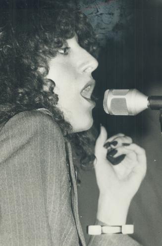 Carole Pope, lyricist and lead singer of Rough Trade, says her songs try to show all those sex games don't have to be so serious, that you can laugh at them. Group's sound is pure disco