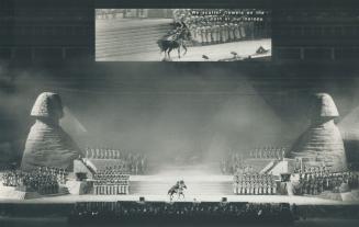 Musical spectacle: Horse and rider are dwarfed against a huge staging in SkyDome as sphinxes and chorus make a dramatic opera setting