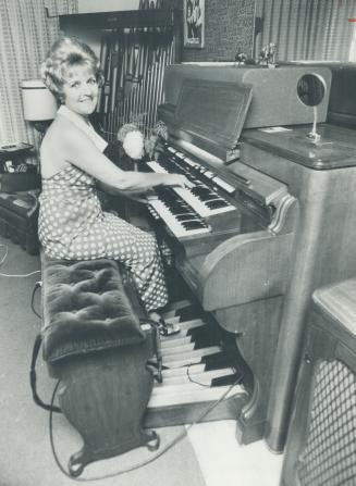Playing her $80,000 organ. When Jeneveve Smith visiting Philadelphia, Pa., a while ago, she went into a bank to cash a $20 cheque and saw 1930 Great S(...)