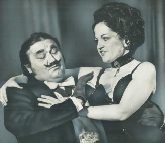 Tenor Phil Stark plays henpecked suitor Alcindoro and soprano Deborah Jeans the flirtatious Musetta in Canadian Opera Touring Company's production of (...)