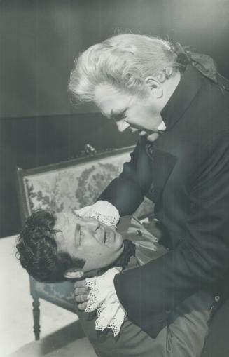 Opera Tosca at O'Keefe Centre. Scarpia (Louis Quilico) attacks Spoletta (Andre Lortie)