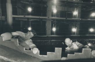 Workers complete set for the Canadian Opera Company's production of Wozzeck, scheduled to open at the O'Keefe Centre next Saturday