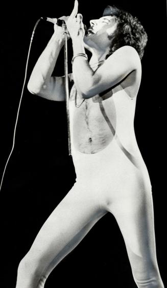Singer-Keyborad player Freddie Mercury brings urbanity ad style to Queen, which started life as another flashy hard-rock band but has developed artistically. It's at the Gardens Tuesday night
