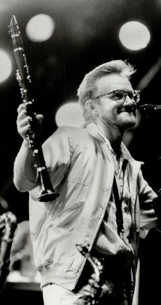 Hello, Toronto: Supertramp's John Helliwell waved clarinet at 25,000 fans who roared their approval of Los Angeles-based rock band's performance at the CNE Grandstand last night