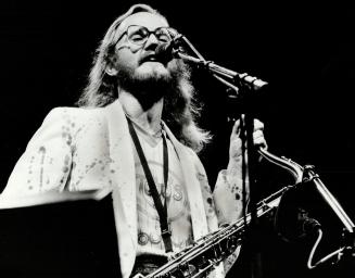 In action: John Helliwell, Supertramp's sax player seen here in concert, will be in Toronto next week to attend the Juno Award and to work on an album being cut by Chris deBurgh