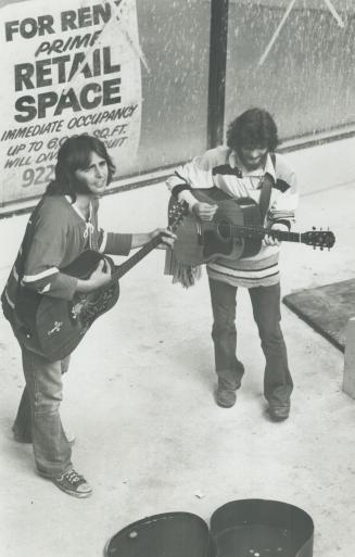 Street Musicians, Cory Nelson (in Canadian sweater) and Bill Shields (bearded and in Bruin sweater)