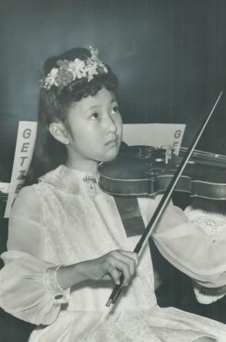 A spring melody. Melody Hayashi, 12, of Ryerson Senior Public School, plays the violin in the 8th annual spring festival concerts of the Toronto Board(...)