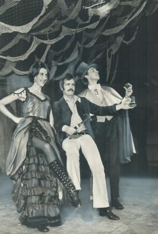 Susan Cox and Don MacQuarrie (right) run through a scene from Old Time Music Hall with Miss Cox's husband and co-director, Terence Durrant. The English-style revue is on the Colonnade stage