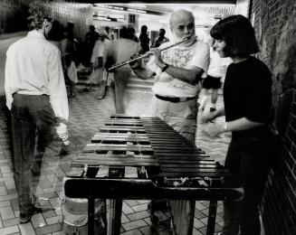 Classic Buskers: Marimba player Nicole Girard and her father and busking partner, flutist Keith, will try for a licence today