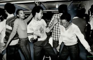 That Caribana spirit Diane Fenton, left, Keith Jobity, centre, and Joan Pierce catch the beat of reggae and calypso music on a 2 1/2-hour dancing crui(...)