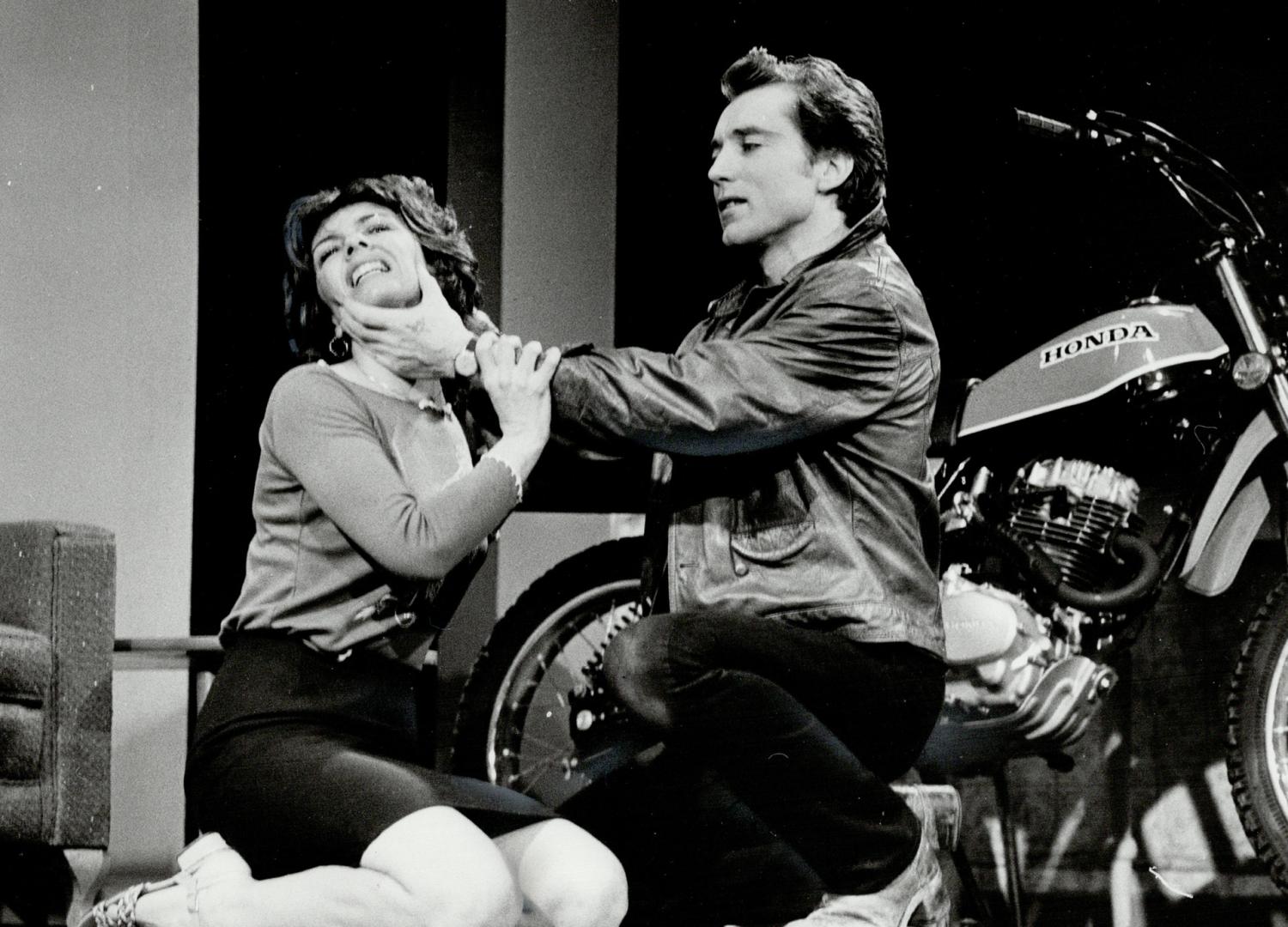 Bikers hit the boards: Frank Moore makes macho menacing gestures toward Lynne Deragon in The Crackwalker, the sociological drama which opened last night at Toronto Workshop Productions