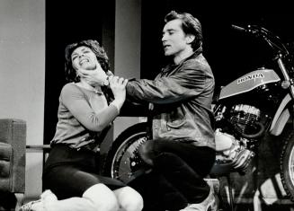 Bikers hit the boards: Frank Moore makes macho menacing gestures toward Lynne Deragon in The Crackwalker, the sociological drama which opened last night at Toronto Workshop Productions