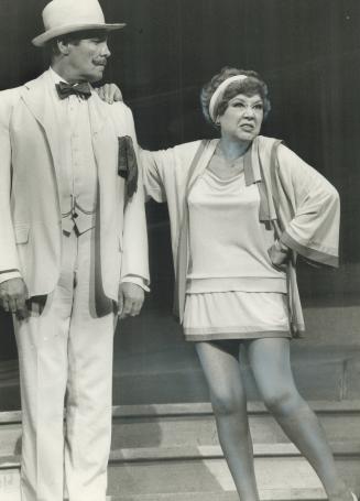 Derek Waring (left) and Glynis Johns in stage production of The Boyfriend, both dressed in 1920 ...