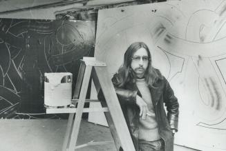 Artist David Craven with his work