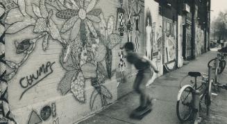 Local artists pitched in to create the mural on Queen St