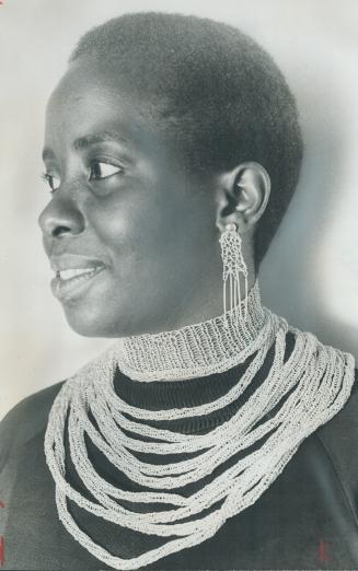 Carol Anderson wears silver necklace she created. Antiguan-born artist describes herself as a jeweller-sculptor