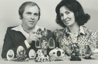 Exquisite art: Marilyn Bourque and her husband, Eugene, inspect some of the beautifully decorated egg shells they'll be showing during special Easter shows in Metro