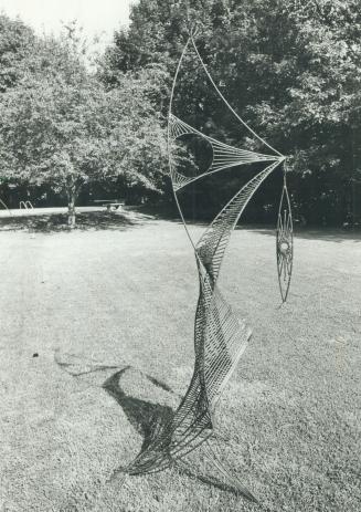 Wire sculpture: A tall wire metal bird, holding a fish in its beak, is the work of Toronto sculptor John Boyd