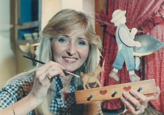 June Bremner works on one of her whimsical pieces