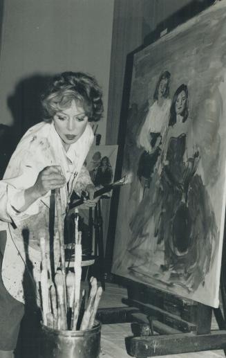 Building an image: Portrait artist Brenda Bury works on her first public 'performance', painting of Arlene Perly Rae and her eldest daughter, Judith, 9