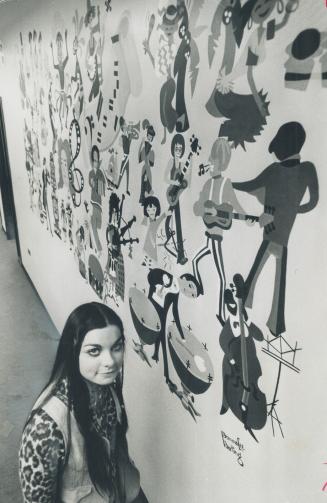 Theme of her mural is music. Donnalee Darling, a Grade 13 student at North Yorks Newtonbrook Secondary Schoo, stands beside the 8 by 12 foot mural she(...)