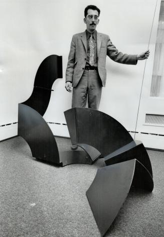 Changeable sculpture of black aluminium, created by Henry Saxe, is hinged together so sections can fold in and out to form various shapes. It is part (...)