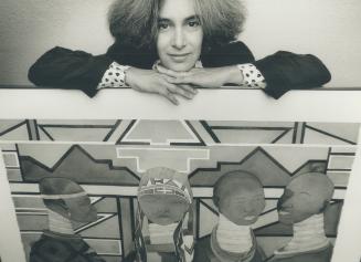 Irene Klar displays her painting for Amnesty International