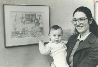 Artist Cara Goldberg Marks, her 9-month-old son Dov with her works at Koffler Gallery