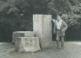 Emil Van Der Meulen stands beside his sculpture, Intersection, which is in a courtyard at Vanier College, York University, for which he also did the l(...)
