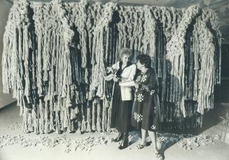 Artist Susan Watson, who created a woven wall hanging like this - only much bigger - for Bell Canada a year ago, is shown, above, trimming her latest (...)