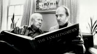A.J. Casson and Paul Duval peruse Duval's latest book on art of J.E.H. Macdonald