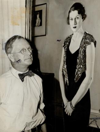 Fred S. Haines, Principal of the Ontario College of Art and Art Commissioner for the C.N.E., with one of the paintings at the C.N.E. show