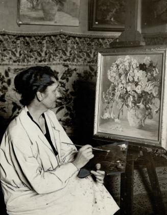 Clara S. Hugarty specializes in painting flowers