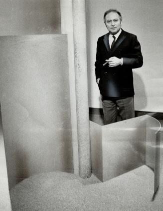 Sculptor Jules Olitski with one of his works