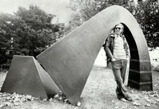 Outdoor art. Pickering artist Bert Trim gets right into his fibre glass creation Leg Arch. The award-winning 1975 work is one of several pieces that d(...)