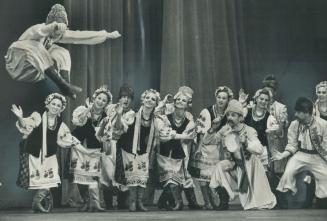 Like human springs, the husky male dancers of Russia's Moiseyev troupe took to the air last night at Maple Leaf Gardens