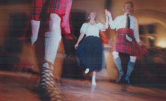 Scottish steps: Wendy Board and Ian Wood of the Royal Scottish Dance Society demonstrate the precision of Scottish country dancing