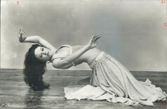 Dancer Diane Calenti, demonstrating her art, above, complains that the press never report the 'good news' about belly dancing