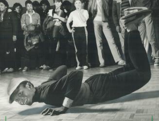 Freestyle: Brian Maynard, at right, and Rawle Maynard, bottom, go wild as the rhythm electrifies their bodies and sends them into a break routine