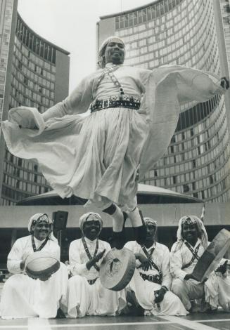 Arabian dancer: Nazha Aman, a member of the Saudi Arabian Folkloric Dance Troupe, performs yesterday at Nathan Phillips Square