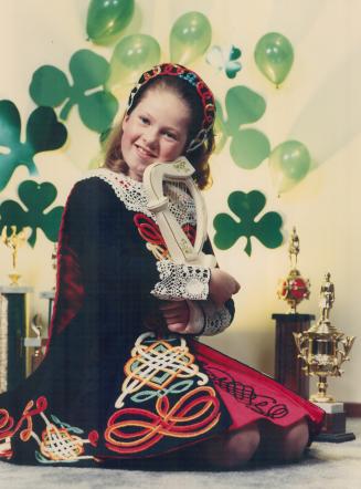 Dancer dressed for St. Patrick's Day. Tricia McQuillan, who will compete in the world championship of irish dancing in treland in apil, is shown with (...)