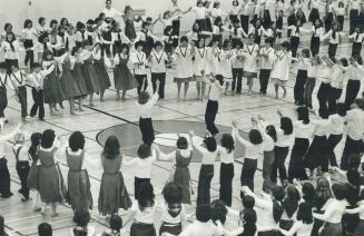 About 350 children form huge circles in the finale of the Israeli dance festival at York University yesterday