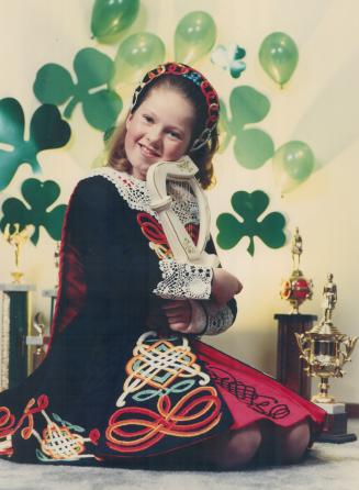 Dancer dressed for St. Patrick's Day. Tricia McQuillan, who will compete in the world championship of Irish dancing in Ireland in April, is shown with(...)