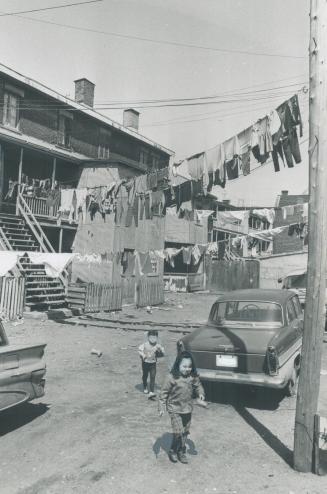 Children like these two in the slums of Montreal are victims of the violence of social injustice, writes Montreal Professor Fred Knelman