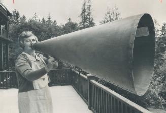 The late president's 5-foot megaphone, used to call boats, is held by Mrs
